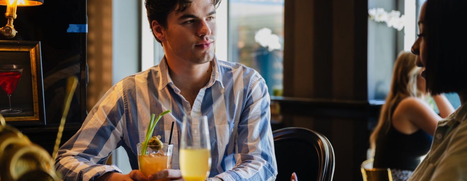 woman talking to a man in a bar