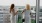 women enjoy neighborhod views on a balcony