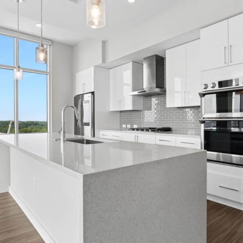 kitchen with white cabinets and quartz countertops